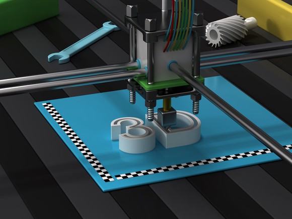 A 3D printer printing the letters "3D."