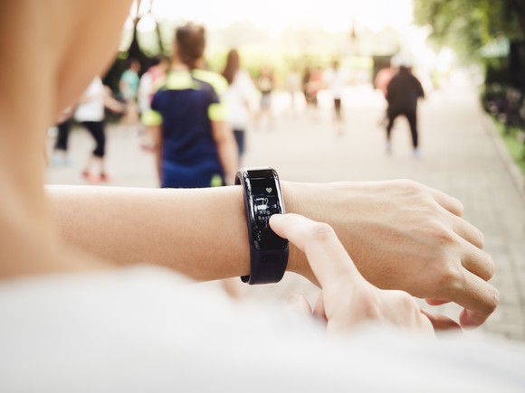 A woman checking her fitness tracker