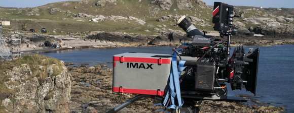 IMAX camera positioned by a lake in a barren location.