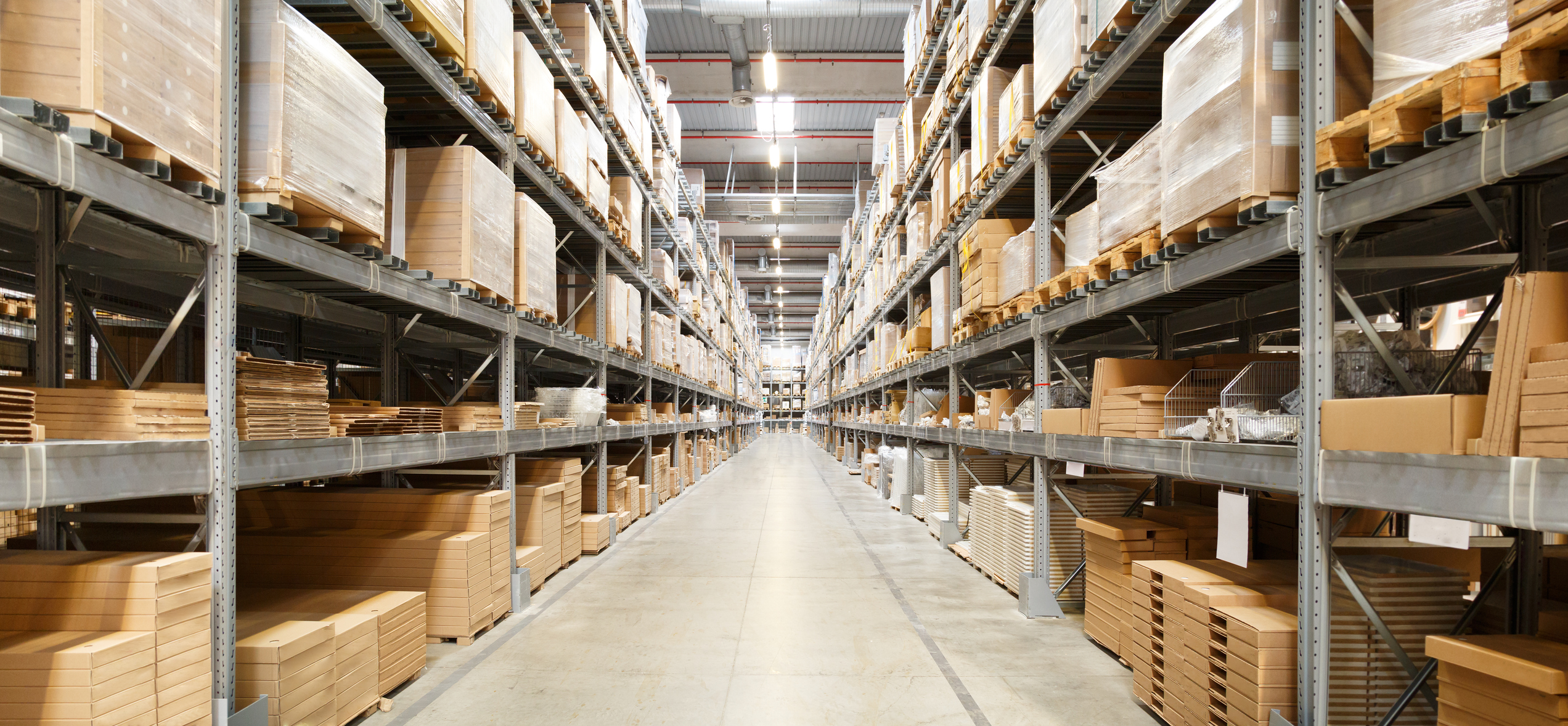 Boxes stacked on shelves in a supply chain warehouse
