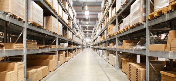 Boxes stacked on shelves in a supply chain warehouse