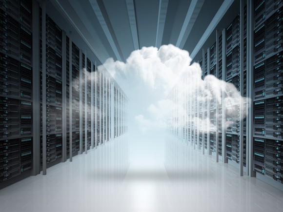 A semitransparent cloud superimposed over photo of a server room