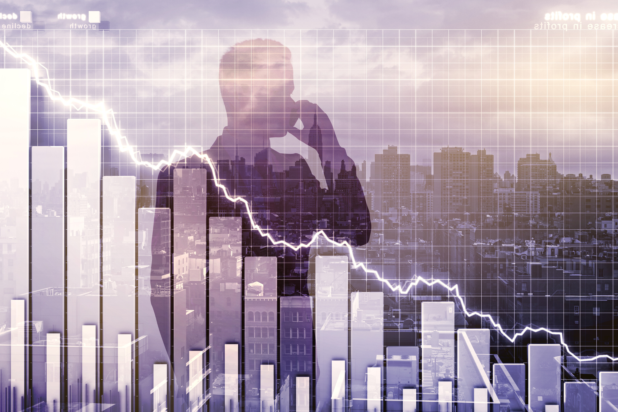 Man's silhouette imposed on declining stock chart