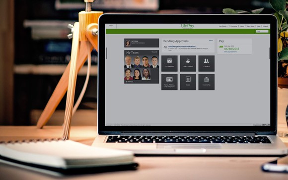 A laptop on a desk running Ultimate Software's UltiPro application.