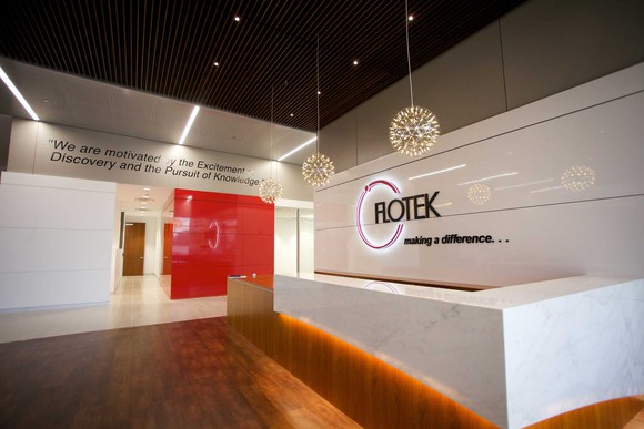 Lobby of a Flotek Industries building, with the company logo on the wall.