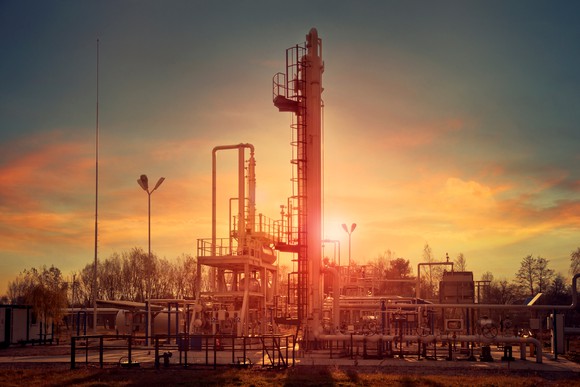 Gas compression unit at sunset
