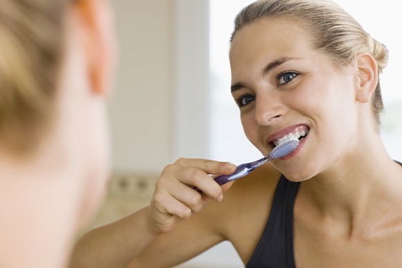 Woman brushing her teeth