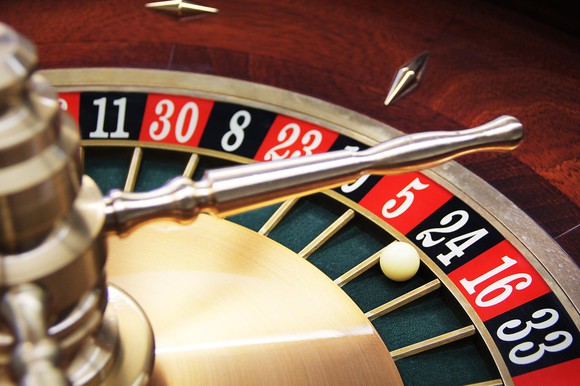 A close-up of a roulette wheel, with the ball on 24.