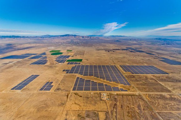 Aerial view of the Solar Star project with mountains in the background.