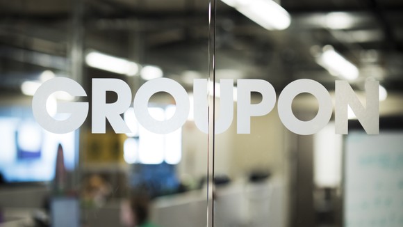 "Groupon" written on its HQ's glass doors.