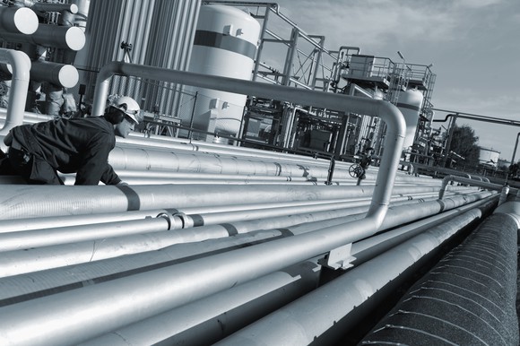 Man working on oil pipeline