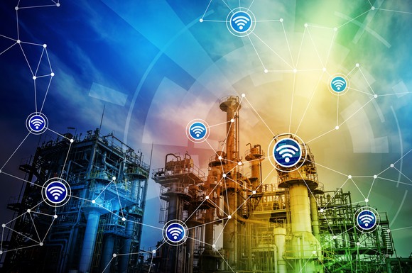 An energy facility with wifi symbols showing a wireless communications network.