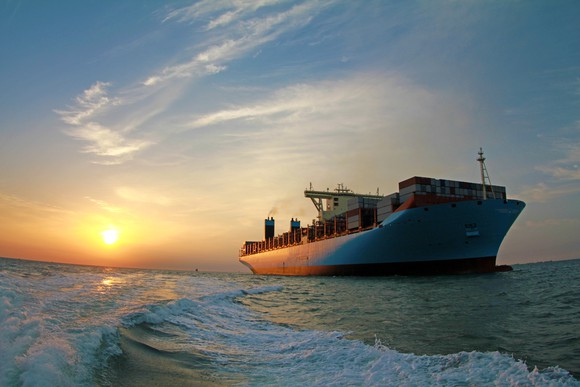 A container ship at sunset.