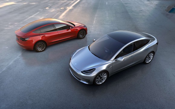 A rendering of two Tesla Model 3 cars