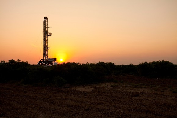 A drilling rig in the Eagle Ford Shale at sunset.