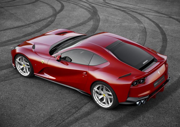 A red 2018 Ferrari 812 Superfast sports car, seen from above.