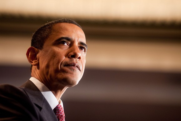 Former President Barack Obama speaking to an audience.