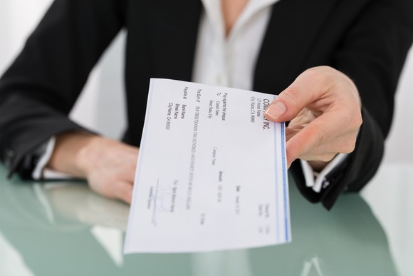 Handing over a paycheck