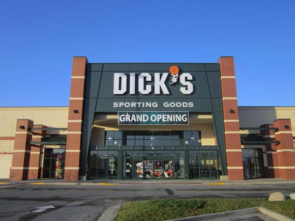 A grand opening banner hangs from the front of a new Dick's Sporting Goods store.