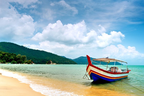 A boat moored on a beach in Malaysia.