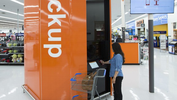 A Wal-Mart customer scanning their cell phone at the Pickup tower.