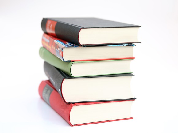 stack of books against a white background