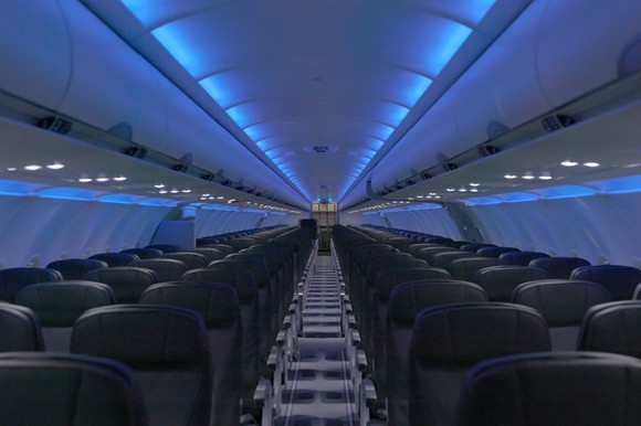 The new interior for JetBlue's A320s features mood lighting and larger TV screens.