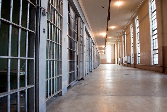 Prison cells and a hallway within a jail.