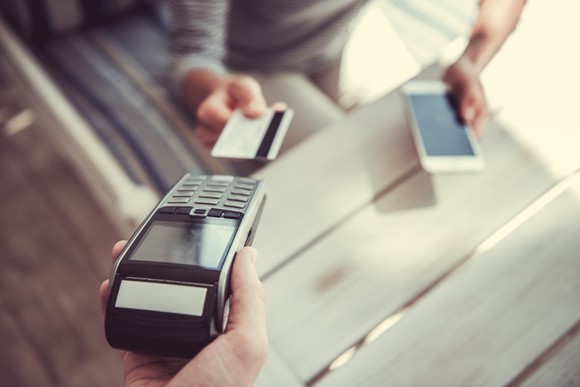 Customer paying with credit card at point of sale