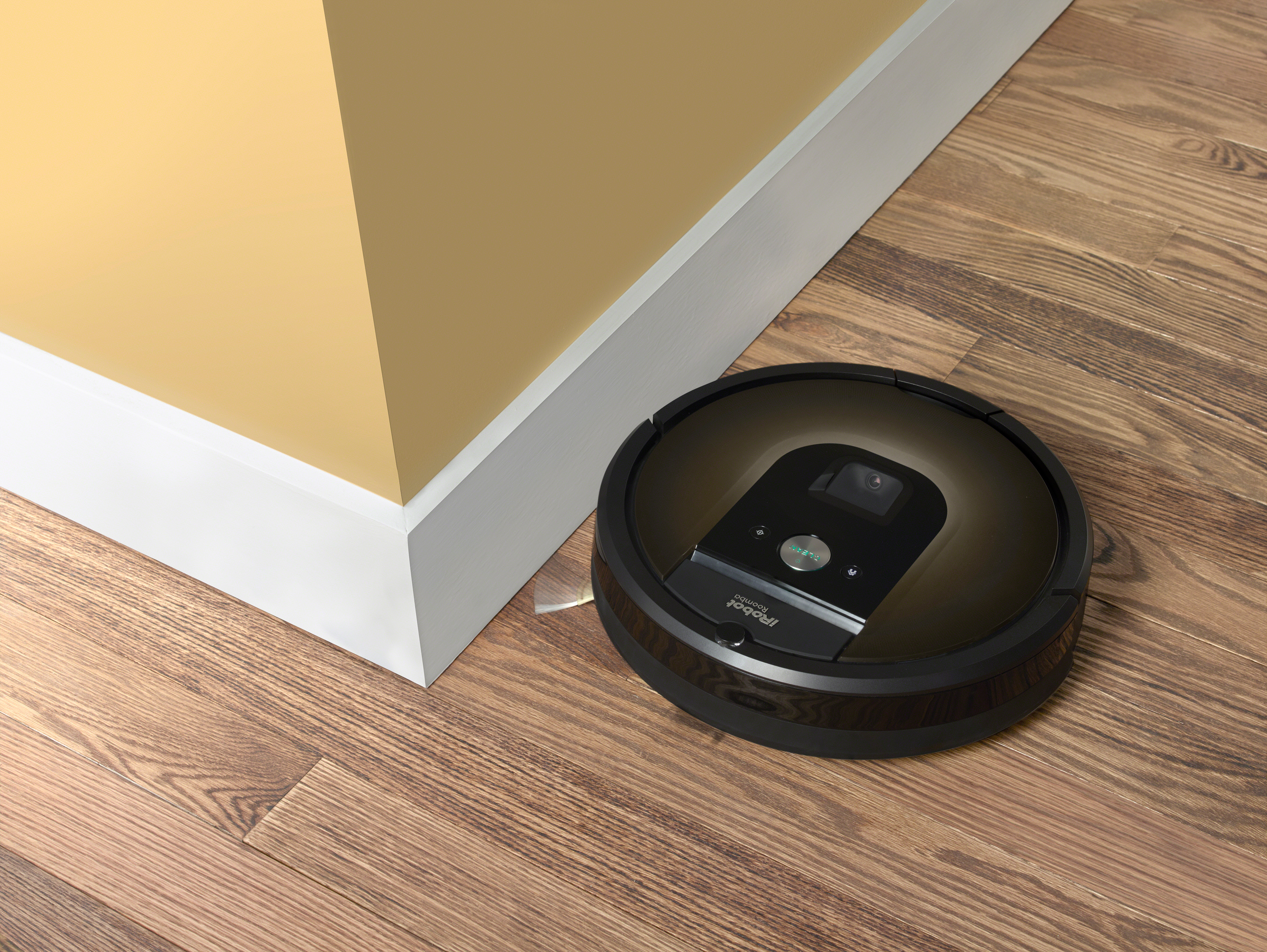 iRobot Roomba cleaning a floor.
