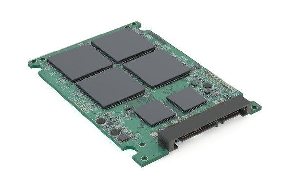 A solid-state storage device with the cover taken off to show the circuit board and chips.