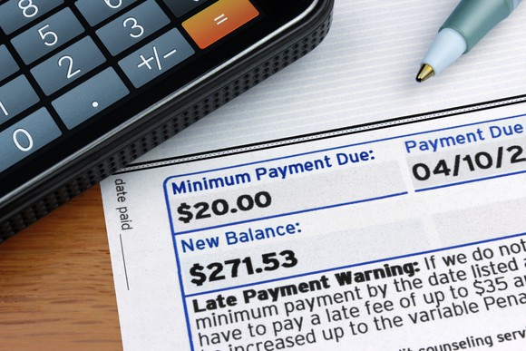 part of a credit card bill is shown, with the minimum due amount shown as $20, along with the new balance and the payment due date