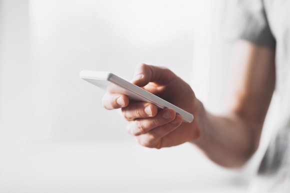 Person using smartphone.