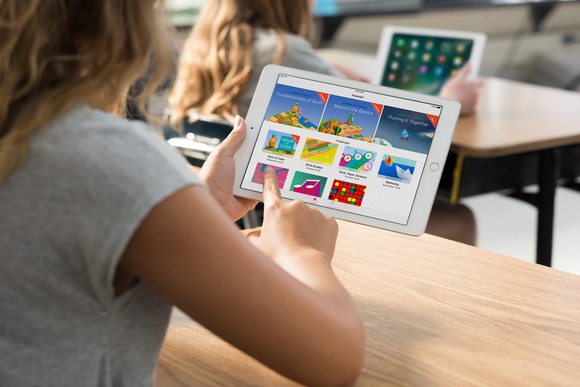 A student using an iPad.