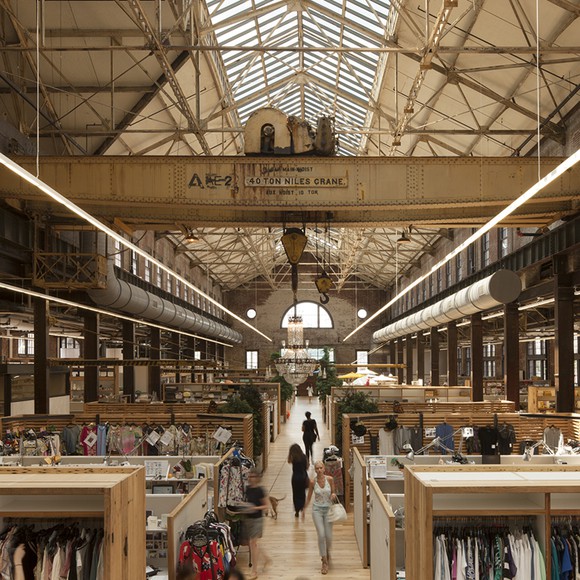 The interior of one of Urban Outfitters' stores. An old urban building restored by the company's designers and is stocked with clothes and home items.