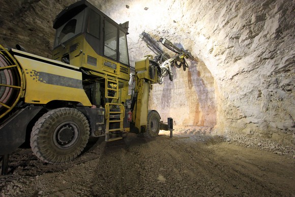 An excavator operating in an underground gold mine.