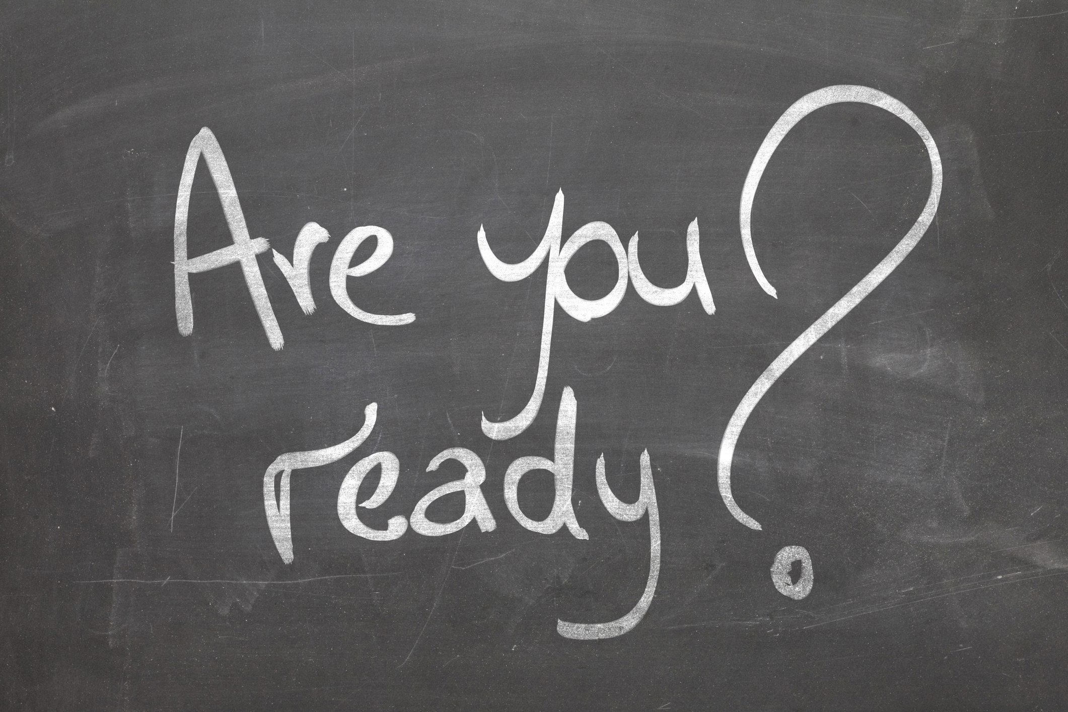 A blackboard has the words "Are you ready?" wrritten on it.