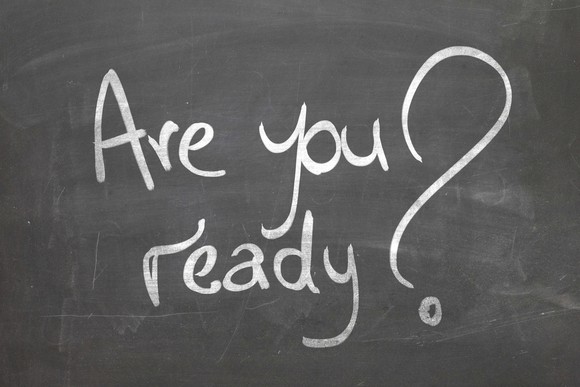 A blackboard has the words "Are you ready?" wrritten on it.