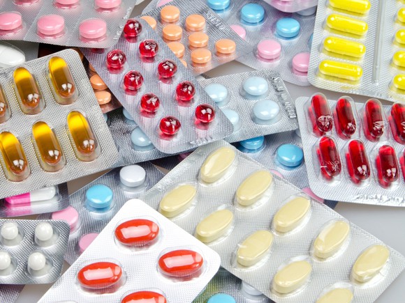Various pills are shown in packages.