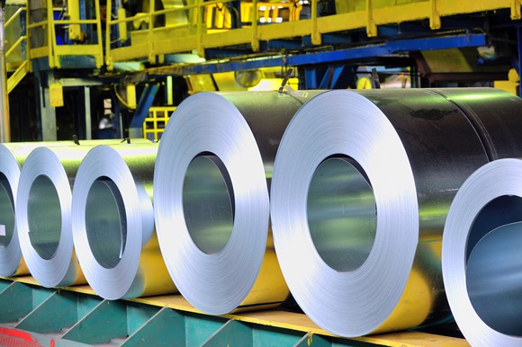 Rolls of metal in a factory.