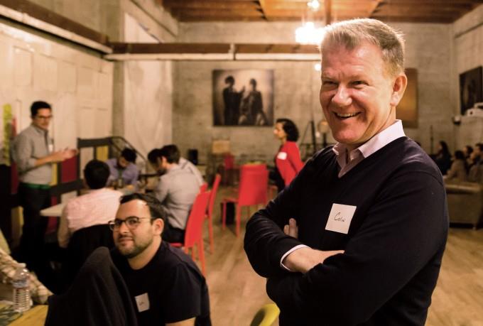 Colin Walsh standing in the foreground of a room. Walsh is a co-founder and CEO of Varo Money.