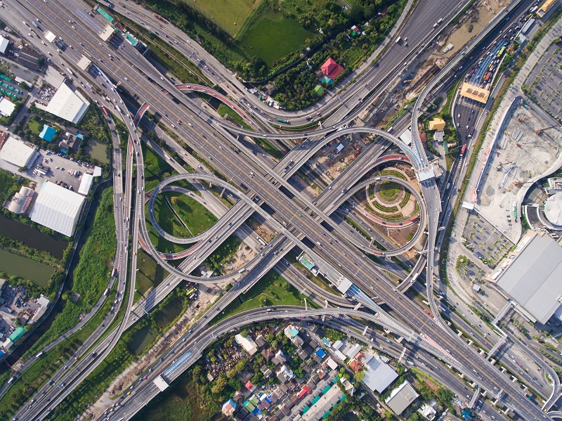 A major highway interchange as seen from a bird's-eye view.
