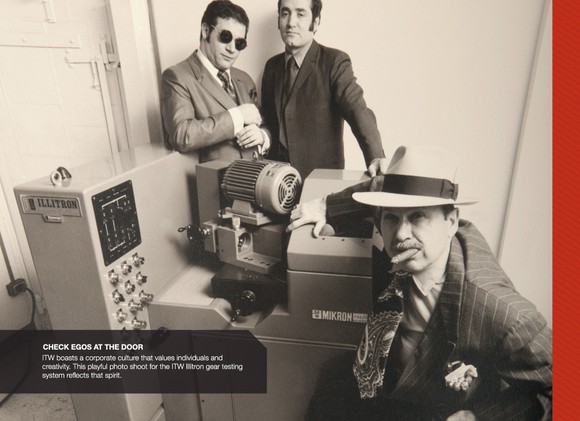 Three people dressed in old-fashioned clothing next to a testing machine.