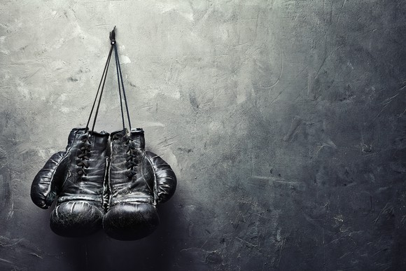 Boxing gloves hanging on a wall.