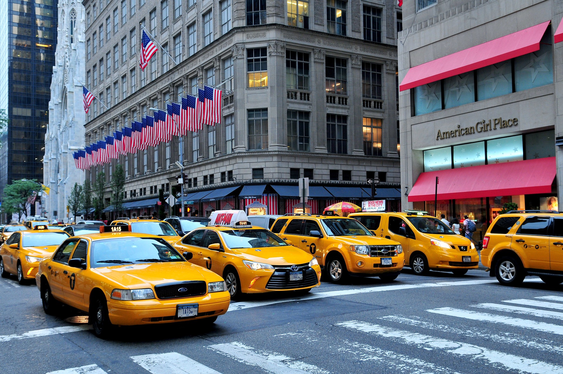 Taxi cabs drive past the Saks Fifth Avenue flagship store in Manhattan