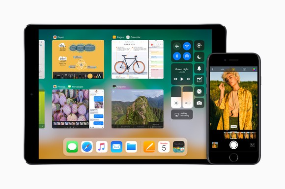 An Apple iPad on the left and an iPhone on the right, both running the upcoming iOS 11 operating system.