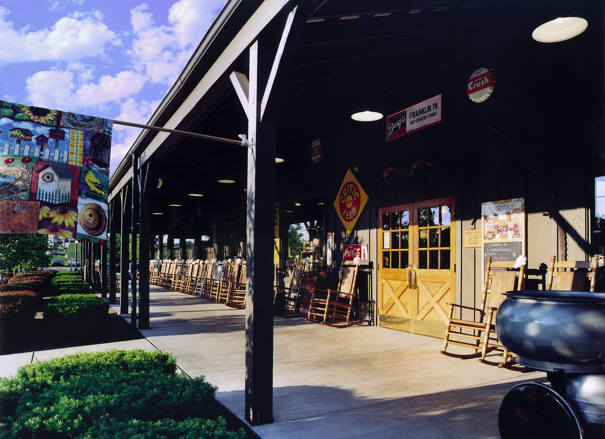 The exterior front porch of an empty Cracker Barrel.