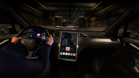 Tesla driver using Autopilot.