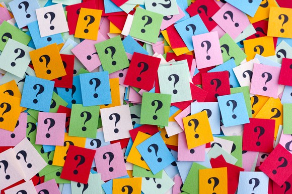 Question marks on multicolored pieces of paper
