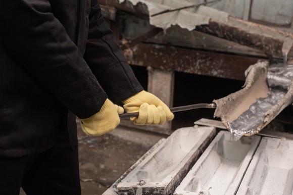 Liquid aluminum being poured into ingots